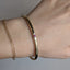 18k Tube Bangle with Peach Sapphire